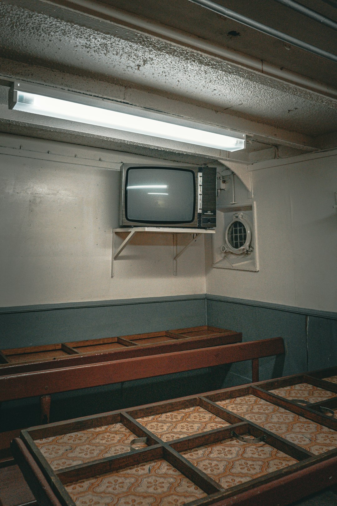 Retro television studio control room with vintage monitors and mixing console
